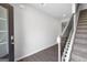 Bright entryway with hardwood floors and a staircase with iron railings at 6904 Oak Valley Dr, Douglasville, GA 30134