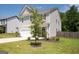 Two-story house with gray siding, white garage door, and a basketball hoop at 6904 Oak Valley Dr, Douglasville, GA 30134