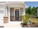 Dark brown front door with glass panels and brick accents at 6904 Oak Valley Dr, Douglasville, GA 30134
