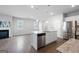 Open concept kitchen with white cabinets, granite counters and stainless steel appliances at 6904 Oak Valley Dr, Douglasville, GA 30134