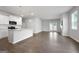 Open concept kitchen with white cabinets, granite counters and stainless steel appliances at 6904 Oak Valley Dr, Douglasville, GA 30134