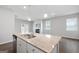 Modern kitchen island with granite countertop and double sink at 6904 Oak Valley Dr, Douglasville, GA 30134