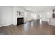 Open living room with hardwood floors and fireplace at 6904 Oak Valley Dr, Douglasville, GA 30134