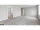 Main bedroom with carpet flooring and ensuite bathroom at 6904 Oak Valley Dr, Douglasville, GA 30134