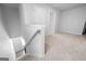 Upstairs hallway with carpet and access to bedrooms at 6904 Oak Valley Dr, Douglasville, GA 30134
