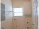 Laundry room with window, cabinets, and shelving at 110 Emily Park, Fayetteville, GA 30215