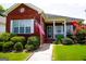 Brick ranch home with front porch and landscaped yard at 110 Emily Park, Fayetteville, GA 30215