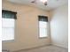 Well-lit bedroom with neutral walls, carpeting, and two windows at 110 Emily Park, Fayetteville, GA 30215