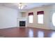Living room with corner fireplace and hardwood floors at 110 Emily Park, Fayetteville, GA 30215