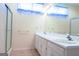 Double vanity bathroom with a large mirror and shower at 110 Emily Park, Fayetteville, GA 30215