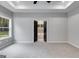 Spacious bedroom with double doors leading to the en-suite bathroom at 831 Banks Cir, Carrollton, GA 30116