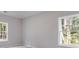 Well-lit bedroom with neutral walls and carpet flooring at 831 Banks Cir, Carrollton, GA 30116