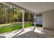 Covered back porch overlooking a wooded backyard at 831 Banks Cir, Carrollton, GA 30116