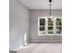 Bright dining room with large windows and modern chandelier at 831 Banks Cir, Carrollton, GA 30116
