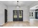 Bright dining room with dark gray accent wall and French doors at 831 Banks Cir, Carrollton, GA 30116