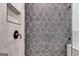 Modern shower with hexagonal gray tiles and glass enclosure at 831 Banks Cir, Carrollton, GA 30116