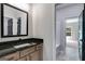 Modern bathroom with granite countertop and a wood vanity at 831 Banks Cir, Carrollton, GA 30116