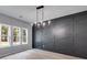 Dining area with gray walls, chandelier, and wooded view at 831 Banks Cir, Carrollton, GA 30116