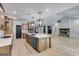 Open concept kitchen with island and view into living room at 831 Banks Cir, Carrollton, GA 30116