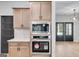 Built-in wall oven and microwave in modern kitchen at 831 Banks Cir, Carrollton, GA 30116