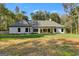 White house exterior with covered porch and landscaped yard at 831 Banks Cir, Carrollton, GA 30116