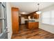 Bright dining area adjacent to kitchen, wood floors at 3572 Stone Ridge Trl, Douglasville, GA 30134