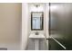 Elegant bathroom with pedestal sink and dark vanity mirror at 1797 Star Point Rd, Carrollton, GA 30116