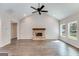 Living room with vaulted ceiling, hardwood floors, and a brick fireplace at 1797 Star Point Rd, Carrollton, GA 30116