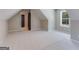 Bonus room with sloped ceilings, window, and access to bathroom at 1797 Star Point Rd, Carrollton, GA 30116
