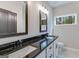Elegant bathroom with dual vanity, granite countertops, and a window at 1797 Star Point Rd, Carrollton, GA 30116