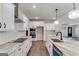 Modern kitchen with white cabinets, granite countertops, and stainless steel appliances at 1797 Star Point Rd, Carrollton, GA 30116