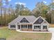 Two story house exterior, two-car garage, front yard at 1797 Star Point Rd, Carrollton, GA 30116
