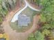 An aerial view of a home on a wooded lot with a private driveway at 1797 Star Point Rd, Carrollton, GA 30116