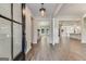 Bright and spacious entryway with hardwood floors and views into the living room and kitchen at 1797 Star Point Rd, Carrollton, GA 30116