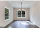 Bright dining room featuring hardwood floors and a chandelier at 1797 Star Point Rd, Carrollton, GA 30116