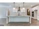 Modern kitchen with white cabinets, large island, and stainless steel appliances at 1797 Star Point Rd, Carrollton, GA 30116