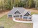 Aerial view of two-story house with large backyard and driveway at 1797 Star Point Rd, Carrollton, GA 30116