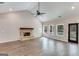 Spacious living room with hardwood floors, a brick fireplace, and a vaulted ceiling at 1797 Star Point Rd, Carrollton, GA 30116