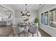 Formal dining room with hardwood floors, wainscoting, and a table set for dinner at 1797 Star Point Rd, Carrollton, GA 30116
