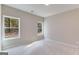 Well-lit bedroom with two windows and neutral wall tones at 1797 Star Point Rd, Carrollton, GA 30116