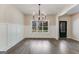Bright dining room with hardwood floors, wainscoting, and a large window at 1797 Star Point Rd, Carrollton, GA 30116