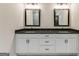 Double vanity bathroom with dark countertops and modern mirrors at 1797 Star Point Rd, Carrollton, GA 30116