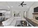 Open living room showcasing a cozy sectional sofa, fireplace, and kitchen at 1797 Star Point Rd, Carrollton, GA 30116