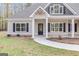 Inviting front porch with black front door and white columns at 1797 Star Point Rd, Carrollton, GA 30116