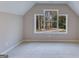 Bright bedroom with a large window offering wooded views at 1797 Star Point Rd, Carrollton, GA 30116