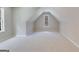 Spacious bonus room with sloped ceilings and two windows at 1797 Star Point Rd, Carrollton, GA 30116