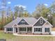 Two-story house exterior, two-car garage, front yard, driveway at 1797 Star Point Rd, Carrollton, GA 30116
