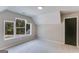 Spacious bedroom with a unique window and neutral color palette at 1797 Star Point Rd, Carrollton, GA 30116