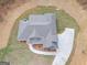 Aerial view of a house with a large backyard and circular driveway at 1797 Star Point Rd, Carrollton, GA 30116