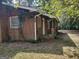 Brick ranch house with a covered porch and shutters at 1030 Mundys Mill Rd, Jonesboro, GA 30238